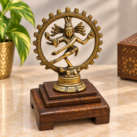 Brass Nataraja dancing Lord Shiva statue on wooden Bajot base, front view