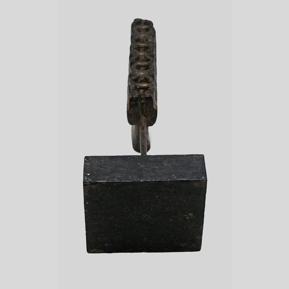 Alternate view of antique wooden textile printing block on stand