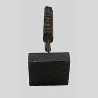 Alternate view of antique wooden textile printing block on stand