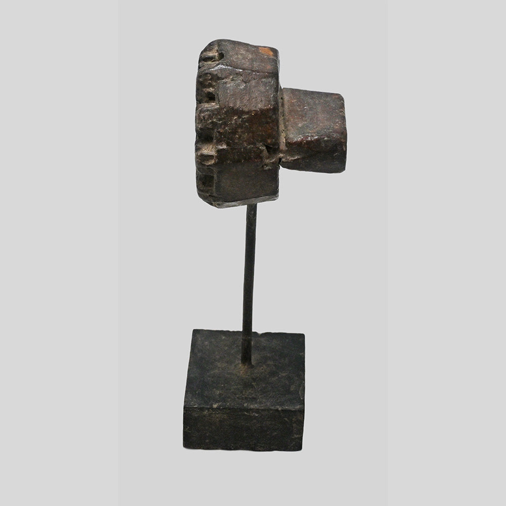 Side view of wooden printing block mounted on display stand