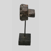 Side view of wooden printing block mounted on display stand