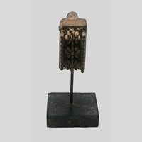 Close-up of raised carving on antique textile printing block
