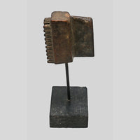 Side view of wooden textile printing block and display base