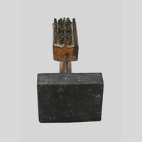 Alternate view of antique wooden textile printing block on stand