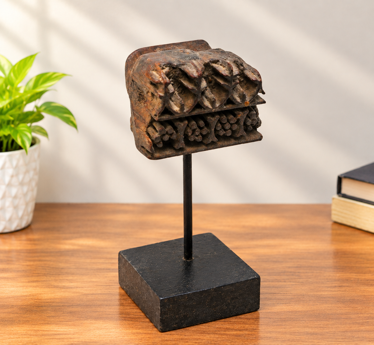 Intricate floral teak wood textile printing block on stand, front view