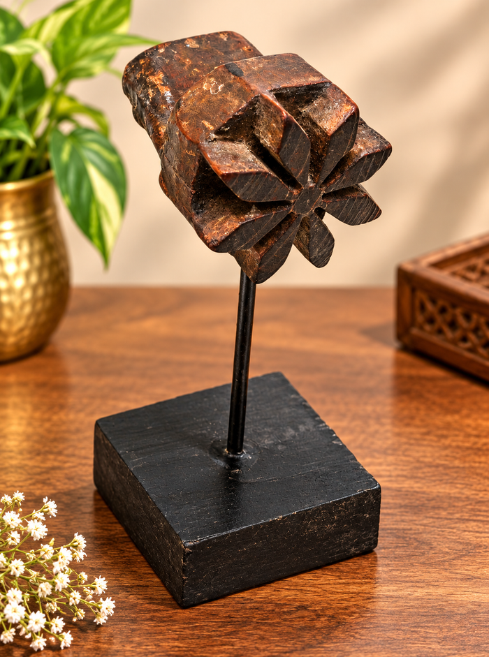 Hand-carved floral star teak wood textile printing block on stand, front view