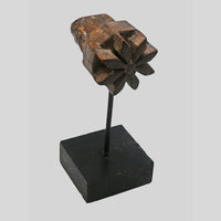 Angled view of star-shaped floral wooden printing block