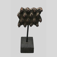 Angled view of carved geometric wooden textile printing block