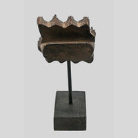 Side view of antique wooden textile printing block and display stand