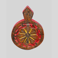 Detail of floral carving on red and brown wooden wall key holder