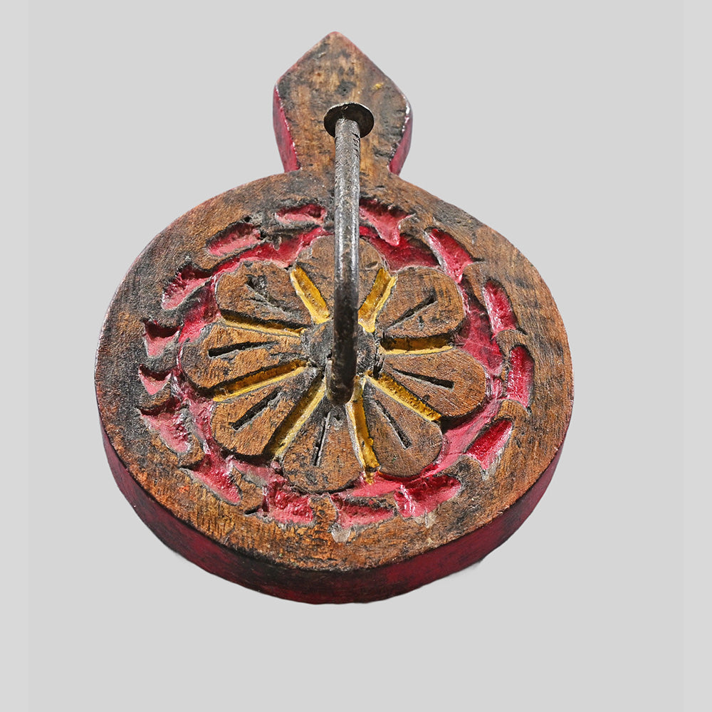 Side view of vintage wooden key holder with red painted edges