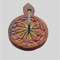 Side view of vintage wooden key holder with red painted edges