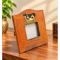 Hand-painted wooden photo frame with cow design, front view