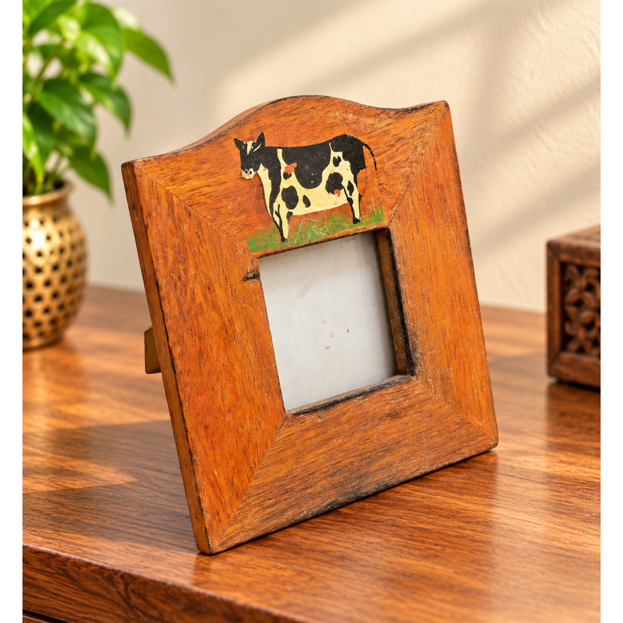 Hand-painted wooden photo frame with cow design, front view