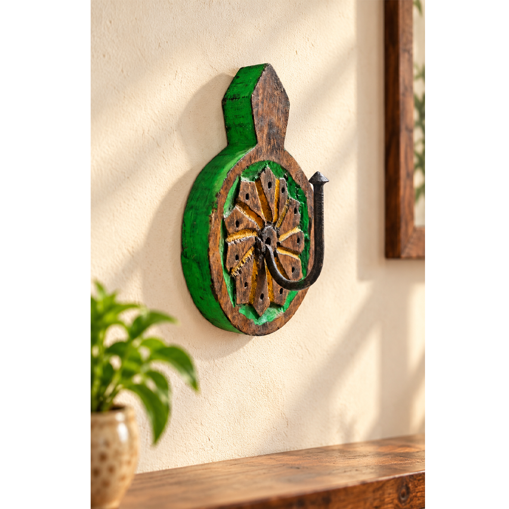 Hand-painted wooden wall hook with floral carving, front view