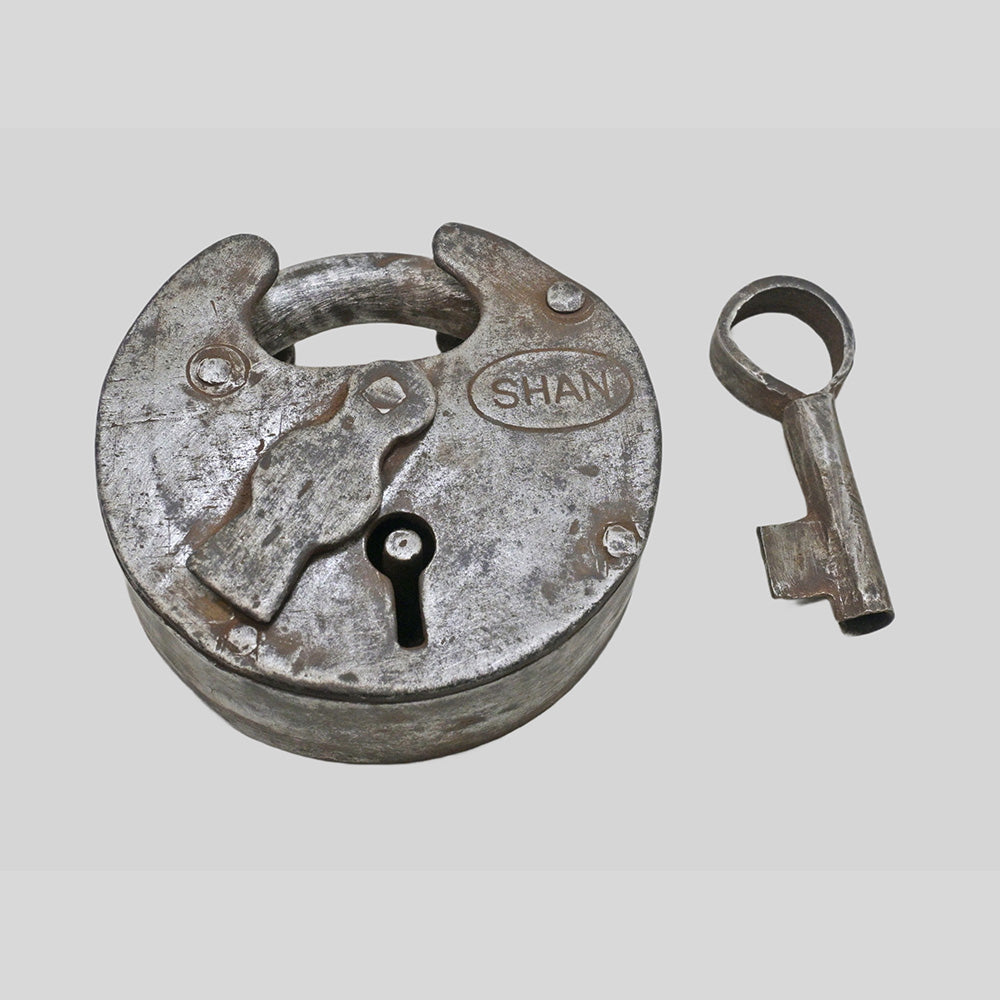 antique Aligarh iron padlock with original key, close-up detail
