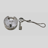 antique Aligarh-style iron padlock with key, close-up detail