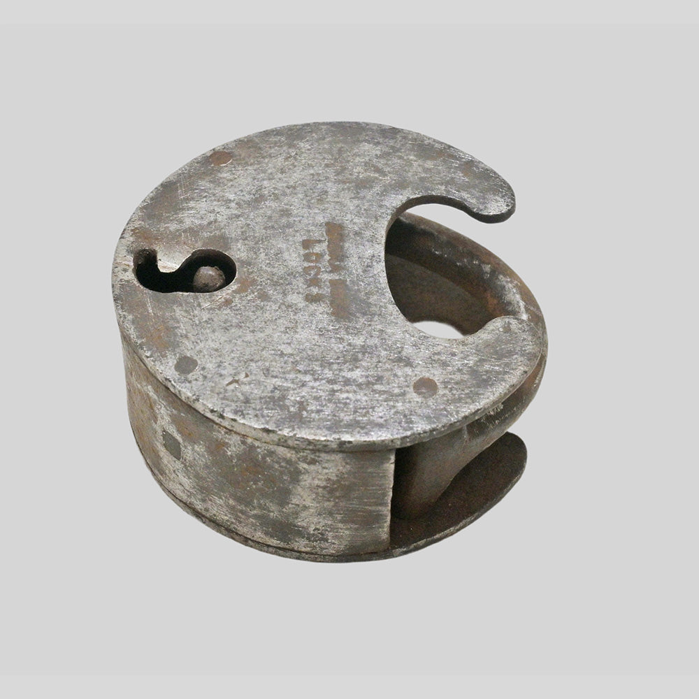 antique Aligarh-style iron padlock with key, side view