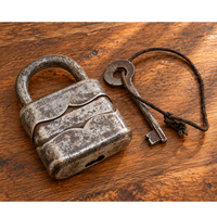 antique German iron padlock with key and rustic finish, front view