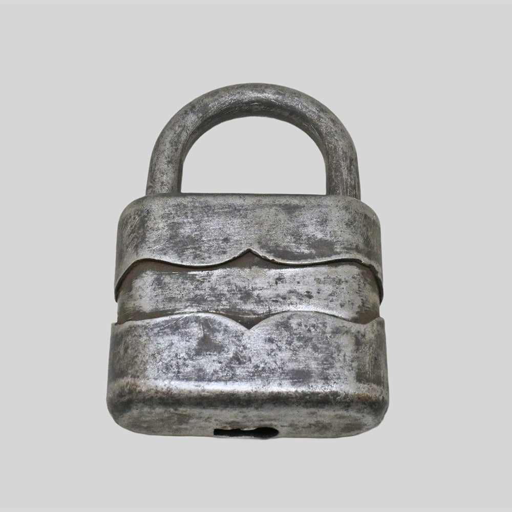 antique German iron padlock with key and rustic finish, close-up detail