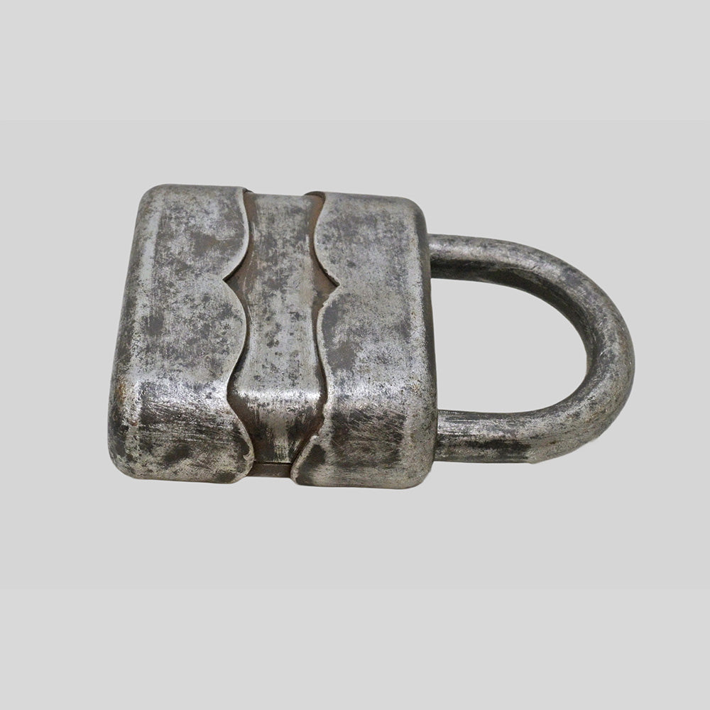 antique German iron padlock with key and rustic finish, side view