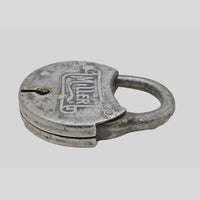 antique round iron padlock with silver finish and key, side view