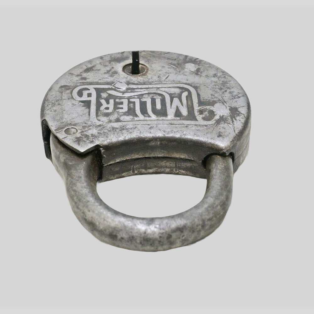antique round iron padlock with silver finish and key, finish detail