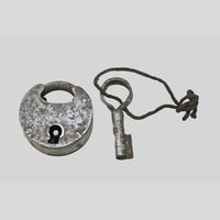 antique iron padlock with original key, close-up detail