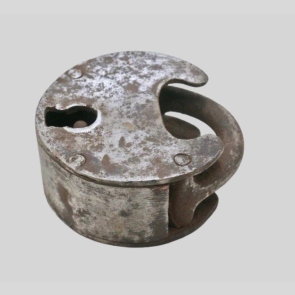 antique iron padlock with original key, side view