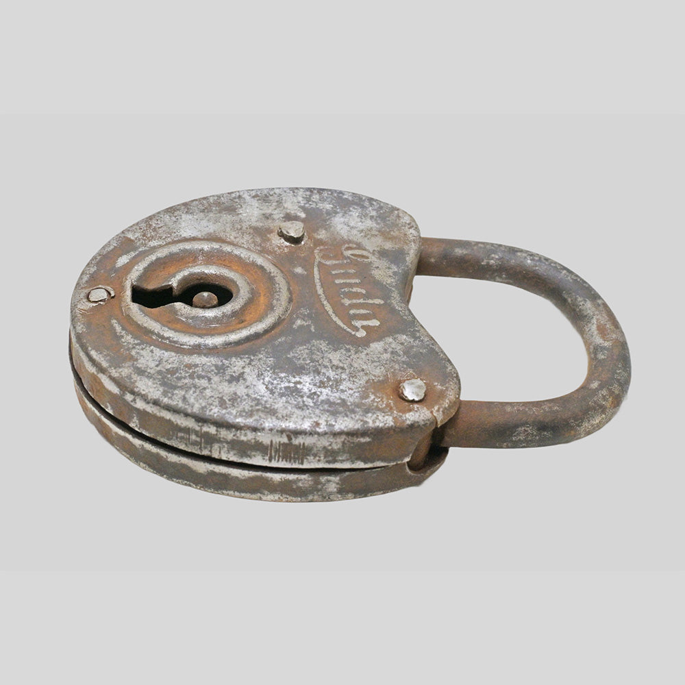 antique Aligarh iron padlock with key, side view