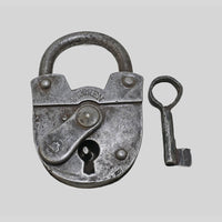 antique iron 2 Touren padlock with key, close-up detail