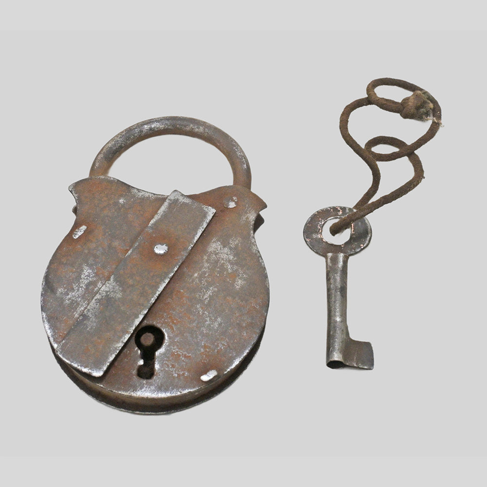 antique Aligarh iron padlock with key, close-up detail