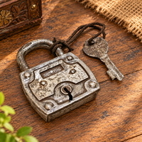 Antique Baldur iron padlock with key in silver finish, front view
