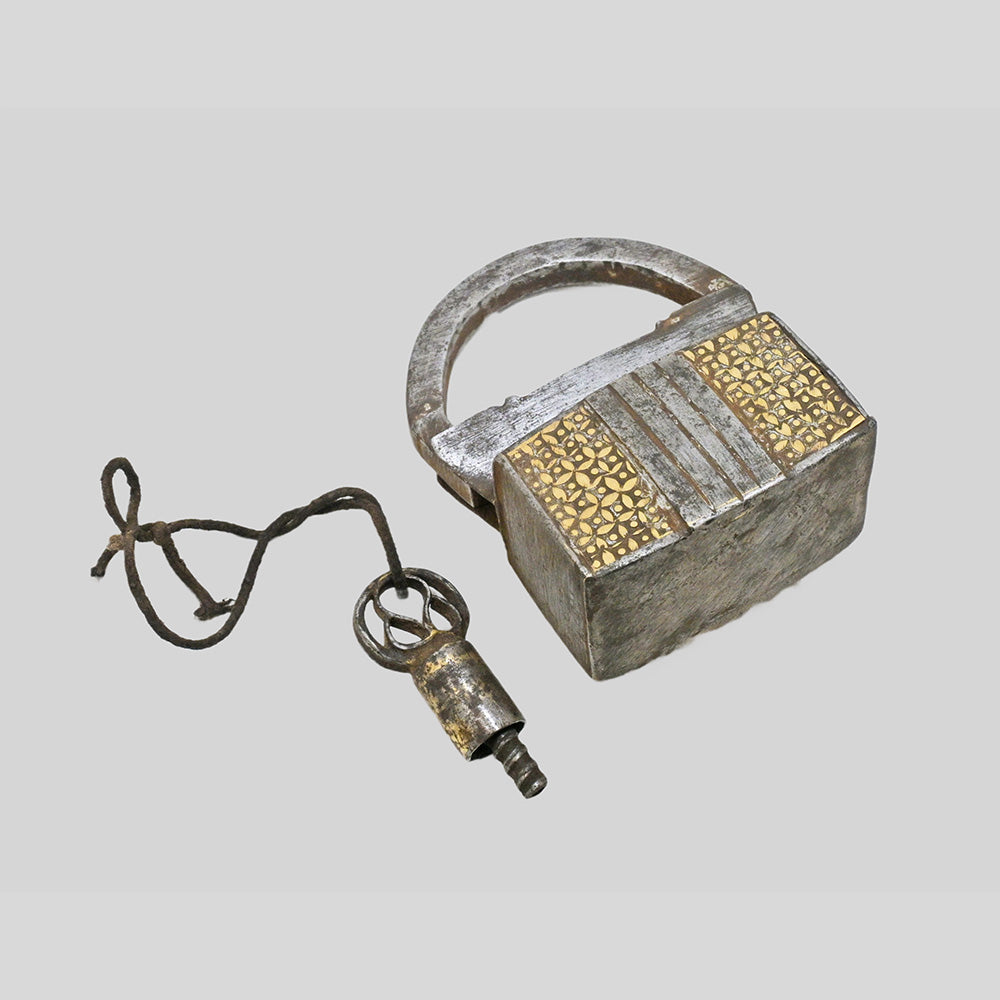 Antique iron spring padlock, angled view