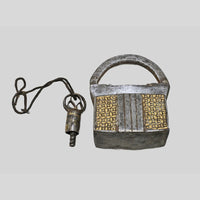 Forged iron body and brass-tone inlay detail