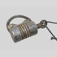 antique gold-tone ribbed metal padlock with original key, alternate angle