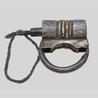 antique gold-tone ribbed metal padlock with original key, finish detail