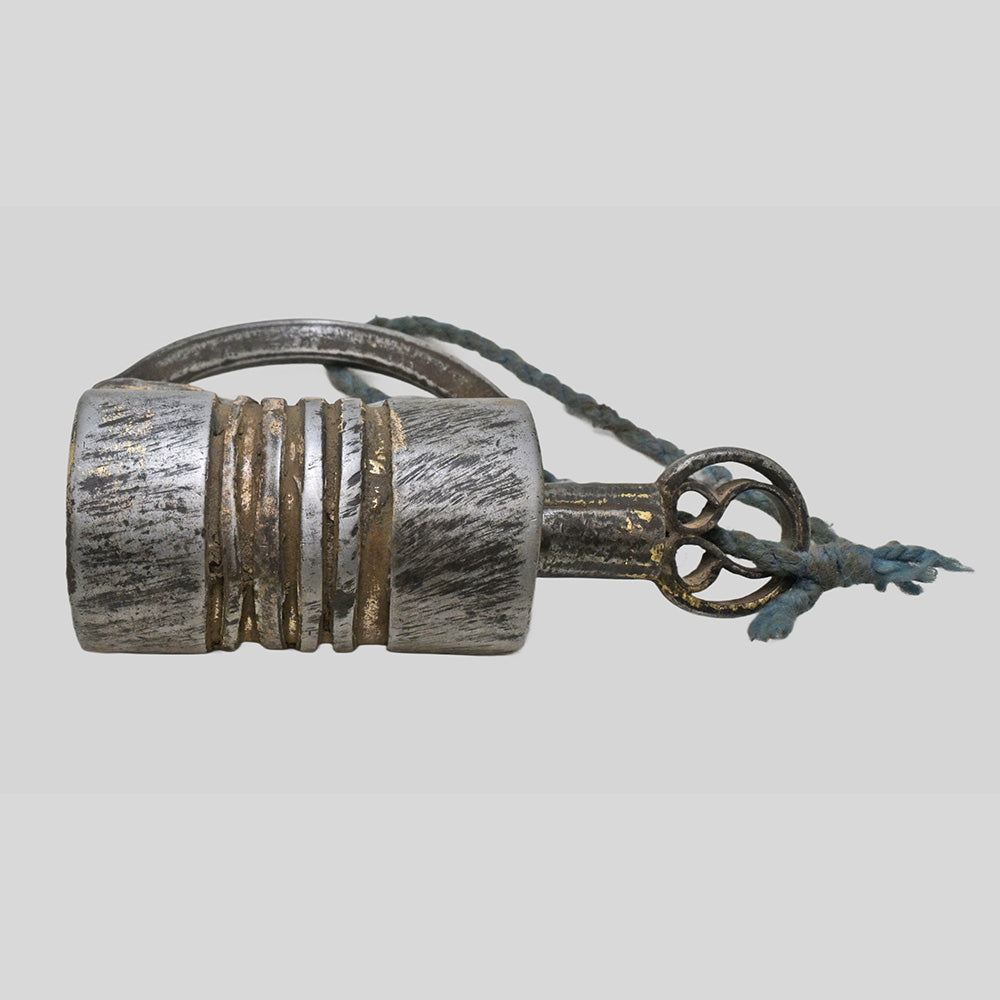 antique gold-tone ribbed metal padlock with original key, additional angle