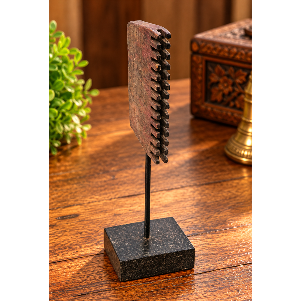 Antique wooden textile printing block on wooden stand, front view