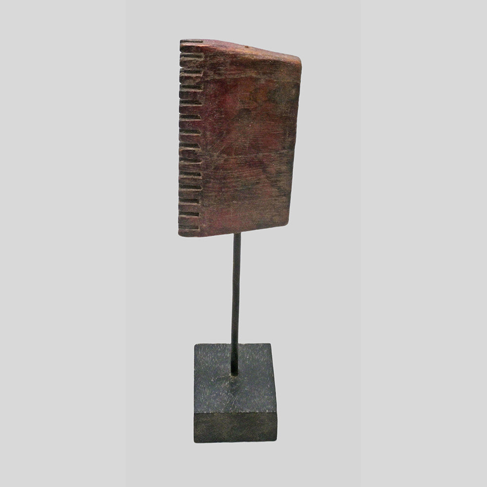 Side view of antique textile printing block