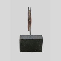 Antique textile printing block on wooden stand, alternate view