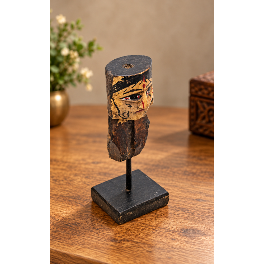 Hand-painted wooden queen bust figurine on display stand, front view
