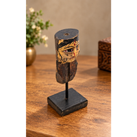 Hand-painted wooden queen bust figurine on display stand, front view
