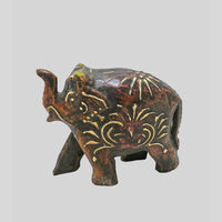 Hand-Painted Wooden Elephant Figurine with hand-painted folk-art patterns, side view