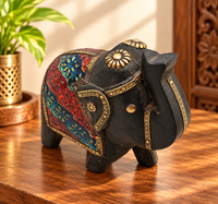 Handcrafted wooden elephant with floral hand painting and brass details