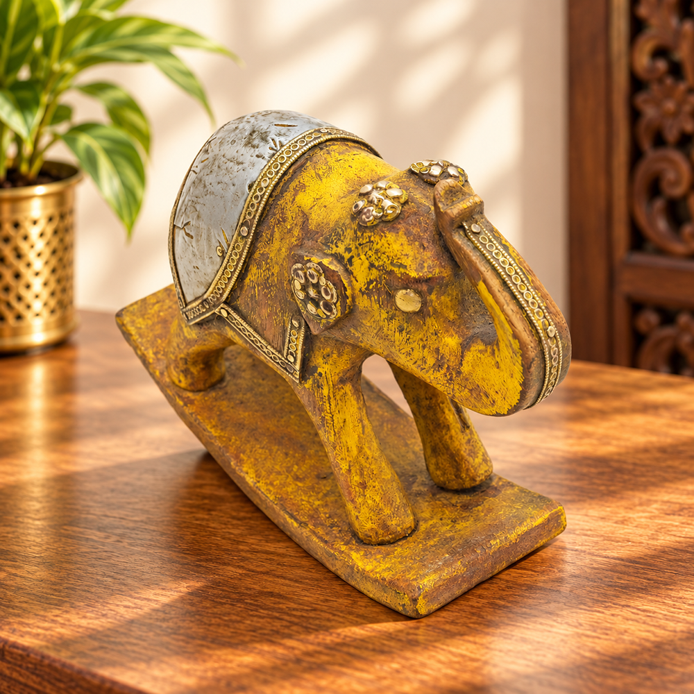 Handcrafted wooden elephant figurine with brass and white metal accents