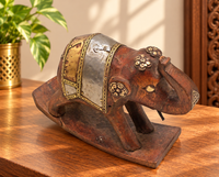 Wooden elephant figurine with brass and white metal detailing