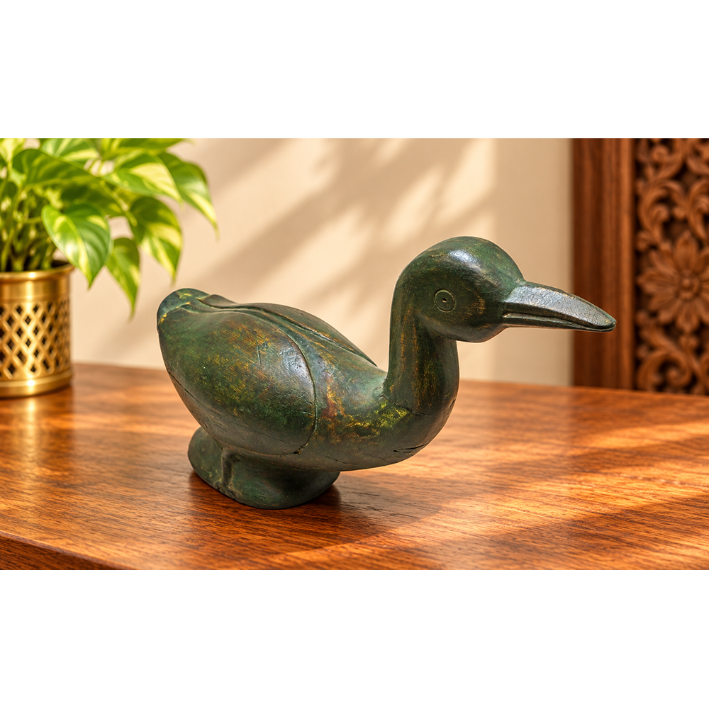 Handcrafted wooden duck figurine in deep green antique finish, front view