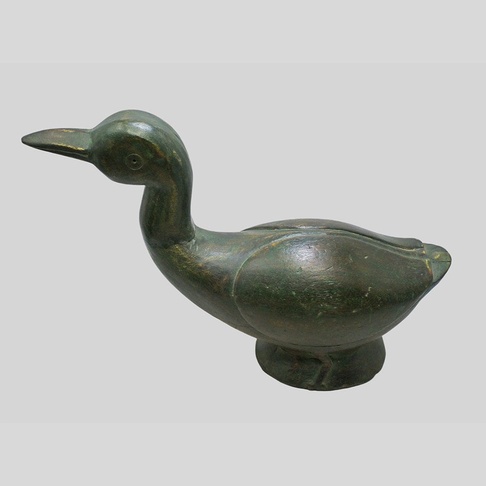 Green wooden duck sculpture, side view