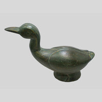 Green wooden duck sculpture, side view
